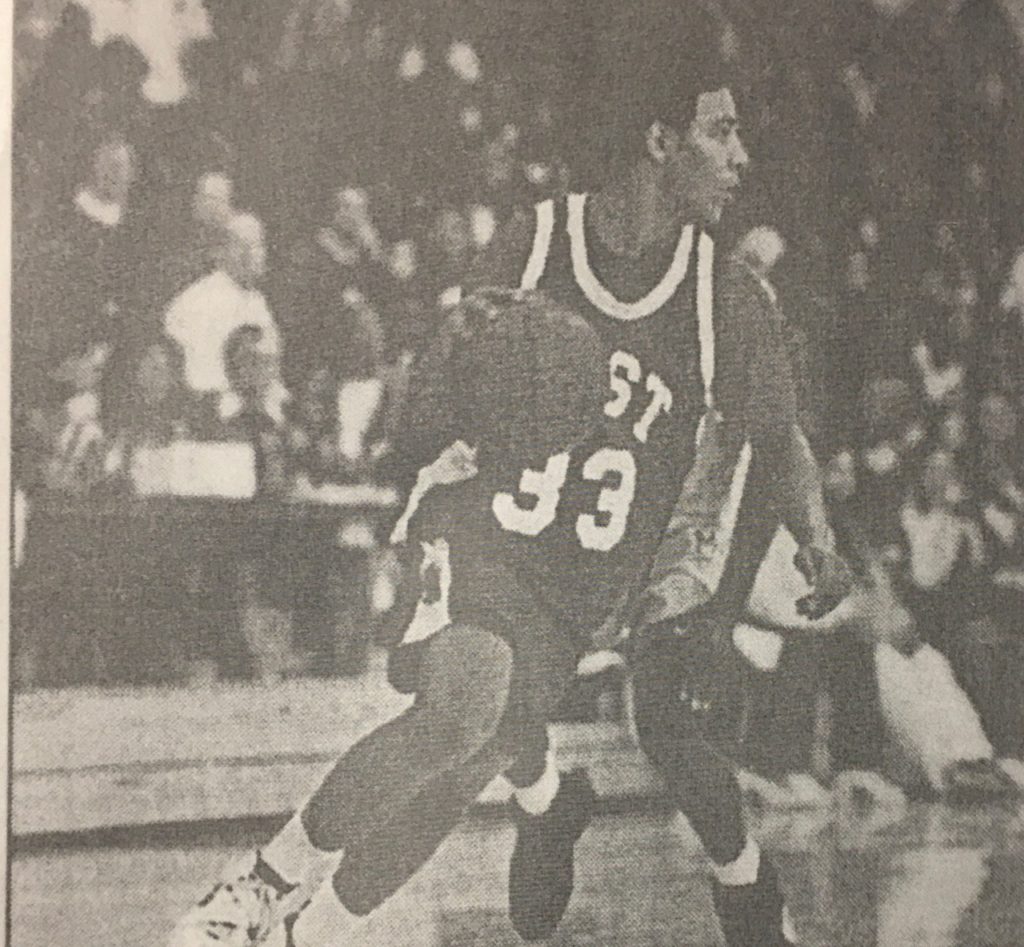 Coach Howard instructing young basketball players in Denver