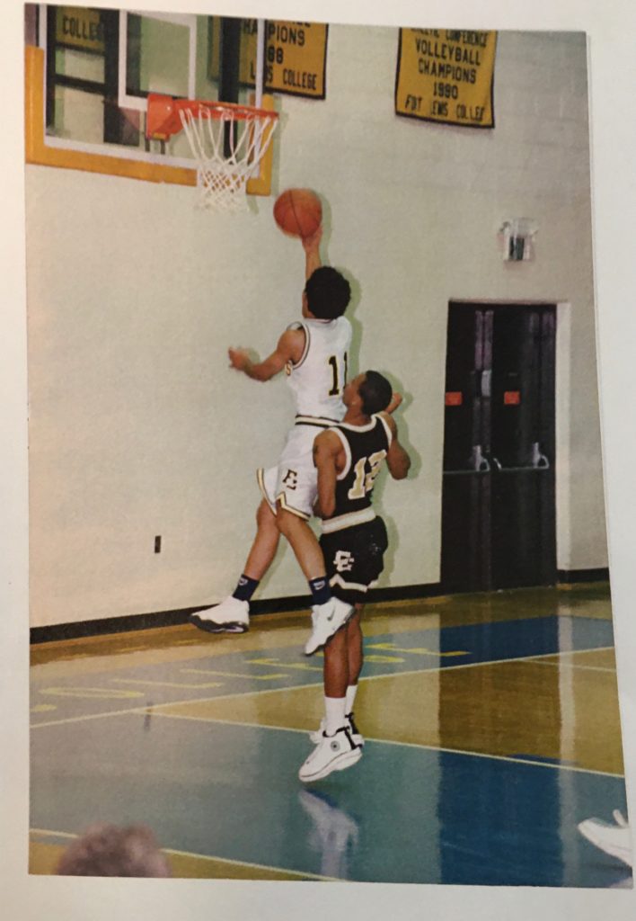 Coach Howard demonstrating basketball techniques